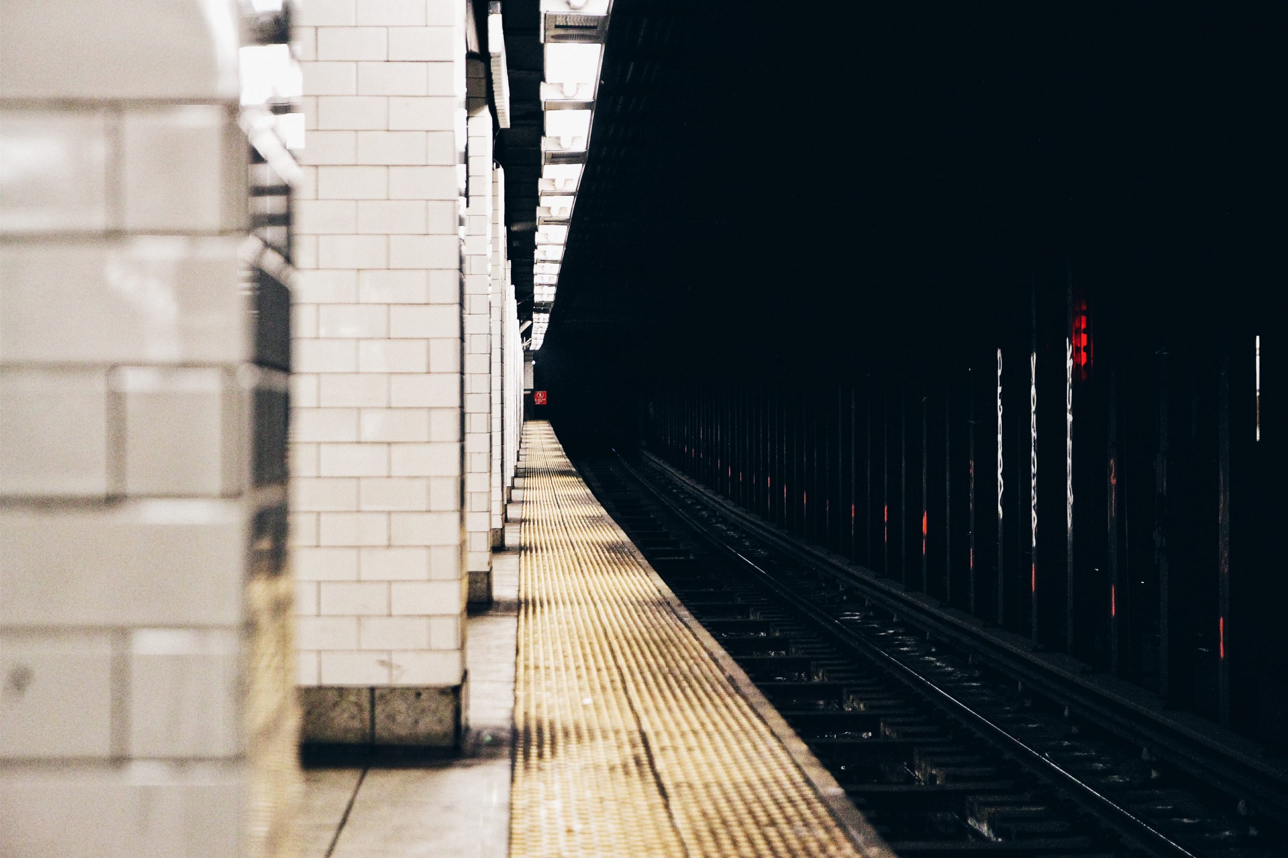 'The view from the edge of the platform reveals a long stretch of subway track.' by MontyLov on Unsplash